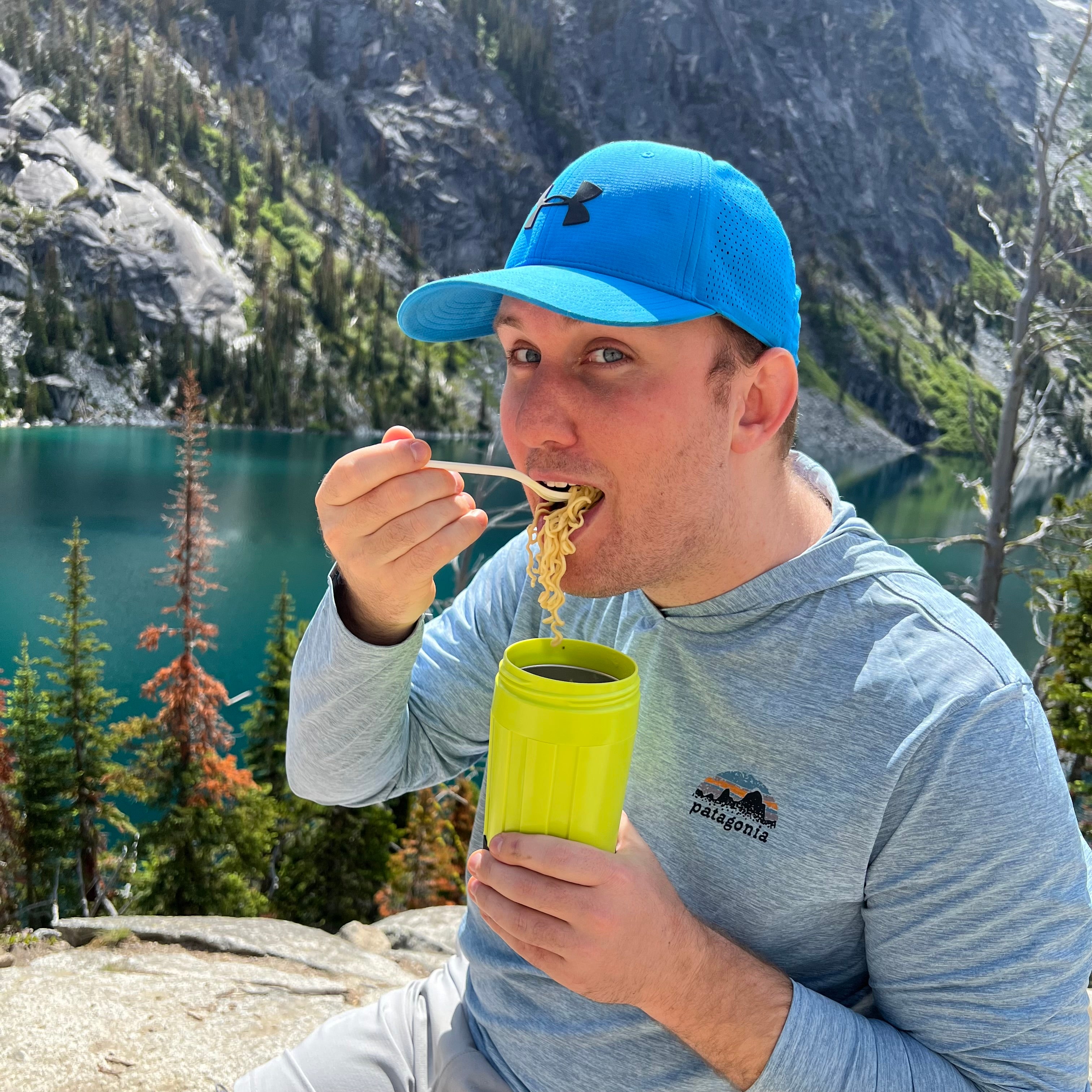Tom Swift, co-founder of EcoSimmer, holding EcoSimmer Electric Backpacking Stove
